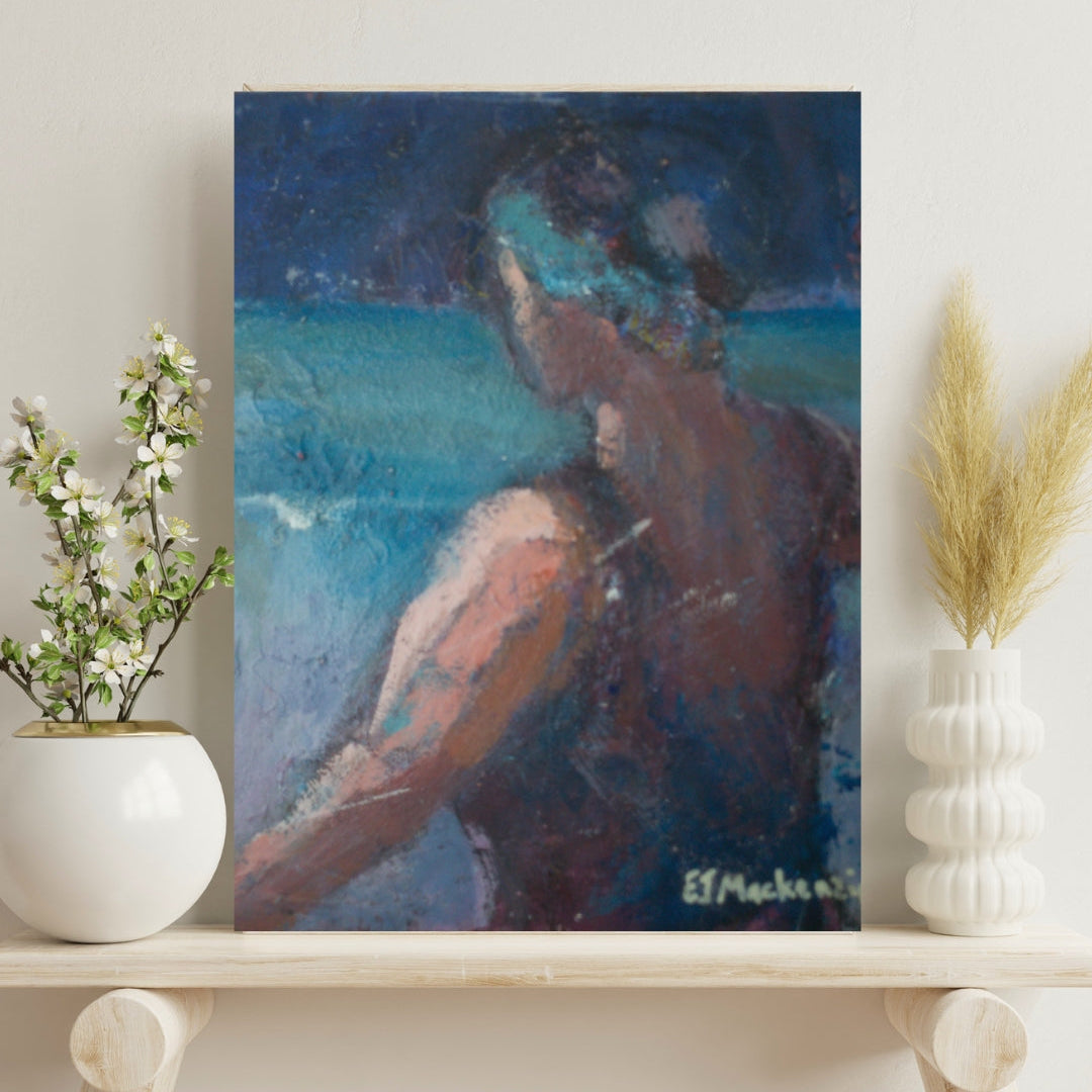A small acrylic painting of a woman on the sea shore