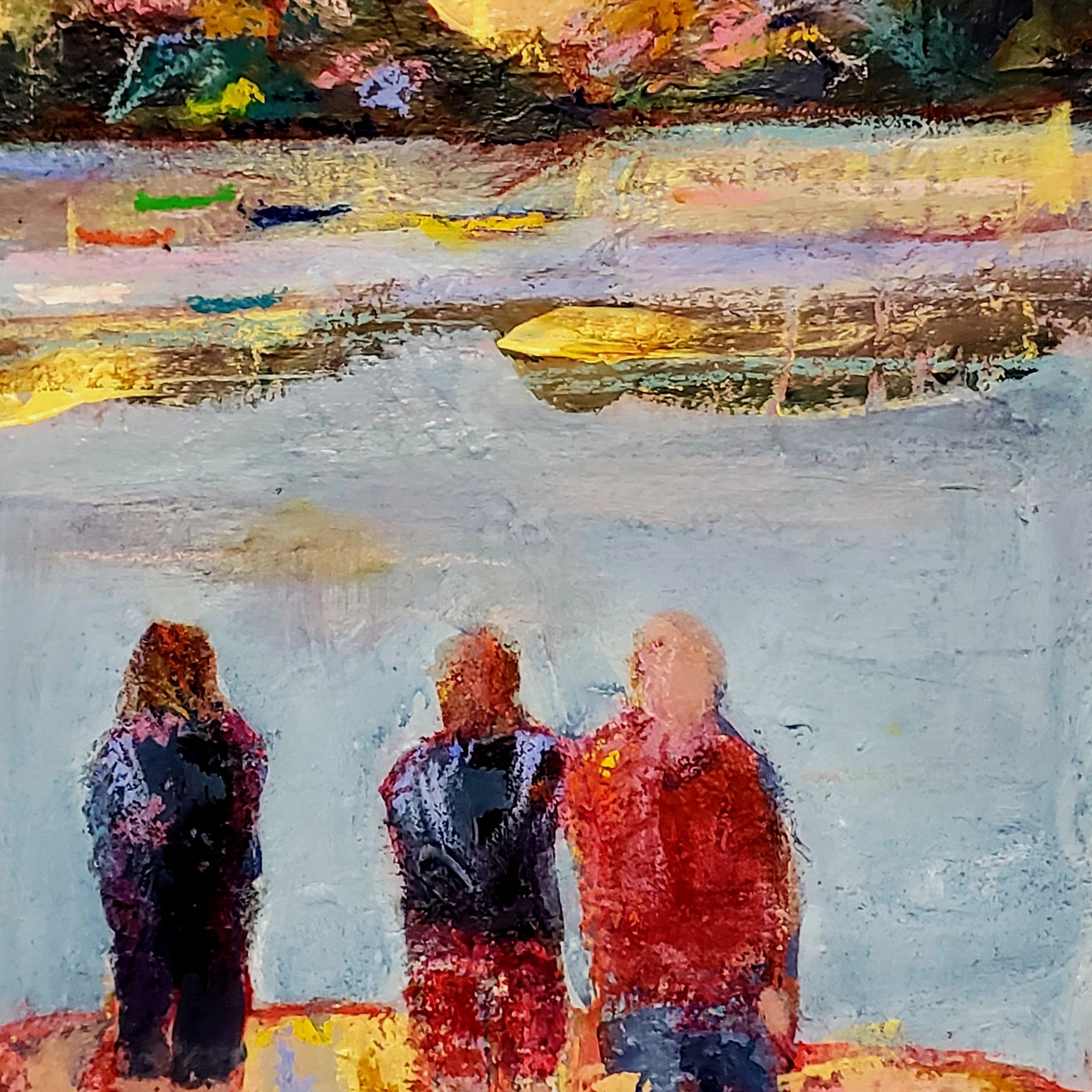 Three people beside water